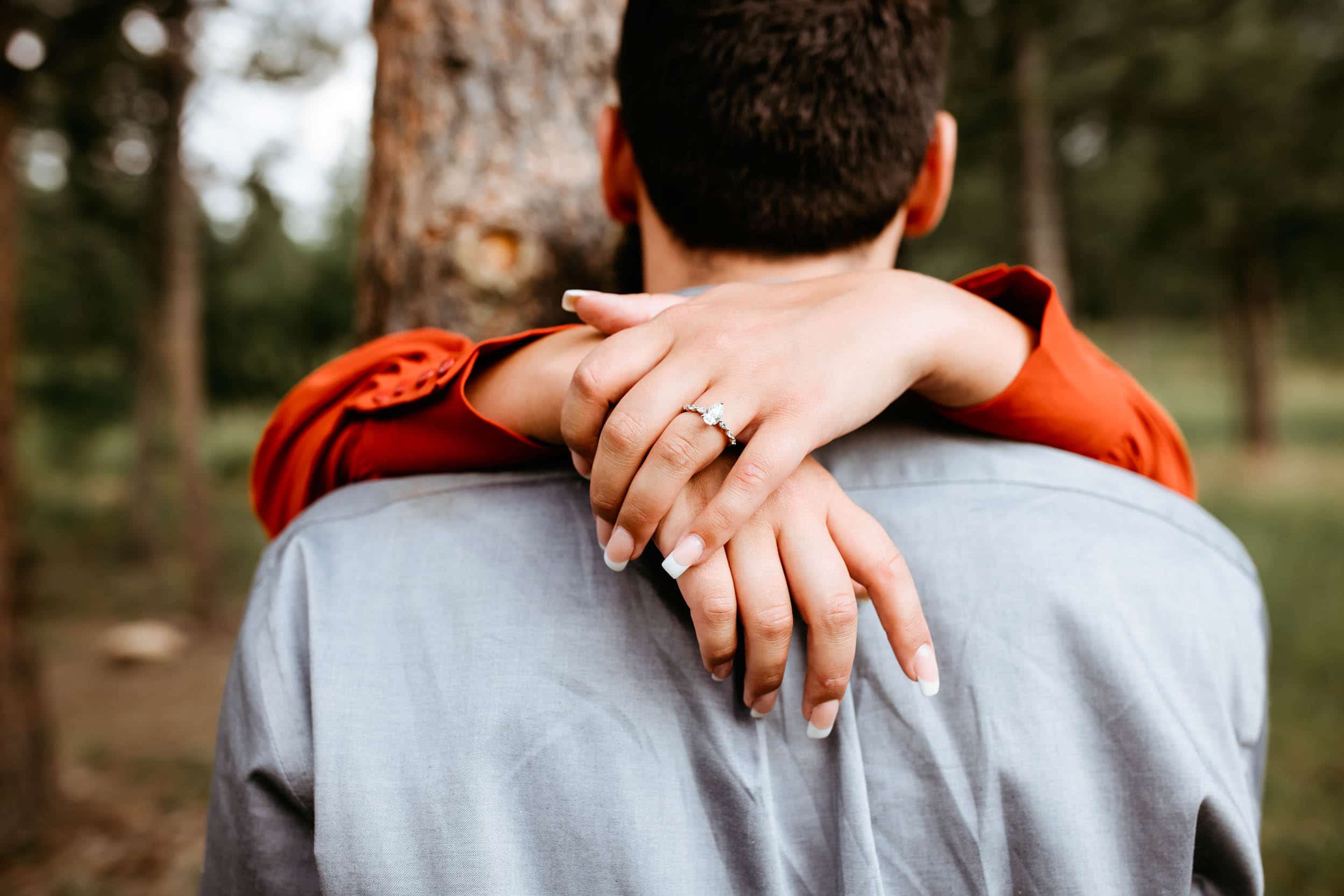 Wooded engagement photos with ring