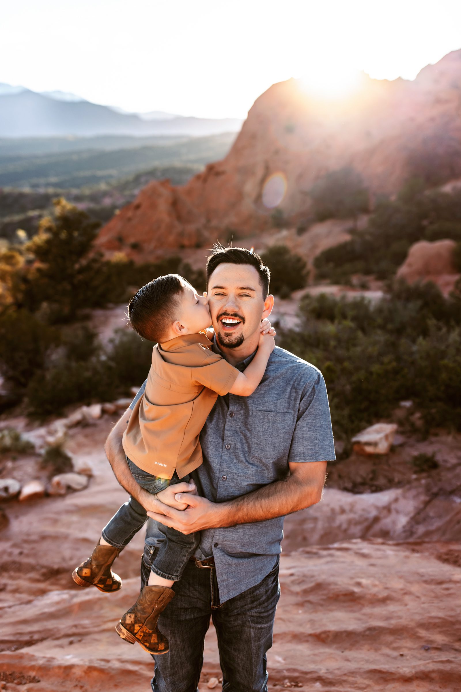A sweet father son moment at a Spring photo session in Colorado at Garden of the Gods