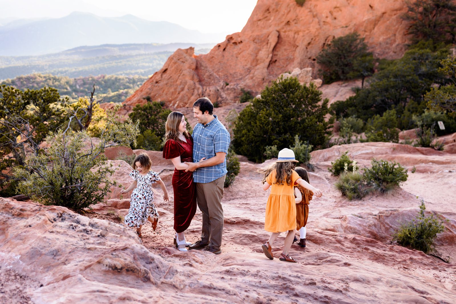Family at Garden of the Gods in Colorado Springs, capturing joyful moments among red rocks and mountains