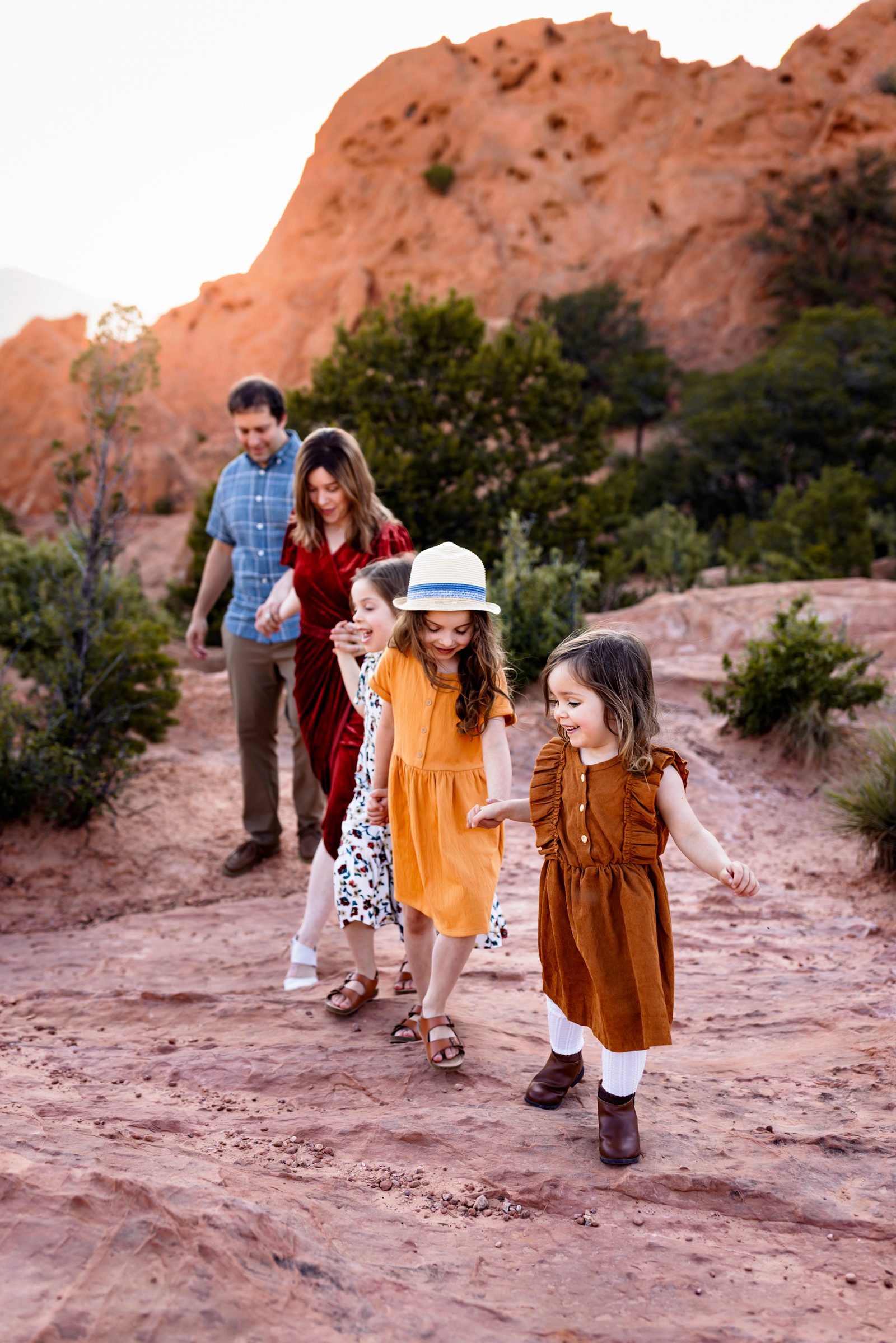 Colorado Springs travel photography session of a family walking together at Garden of the Gods