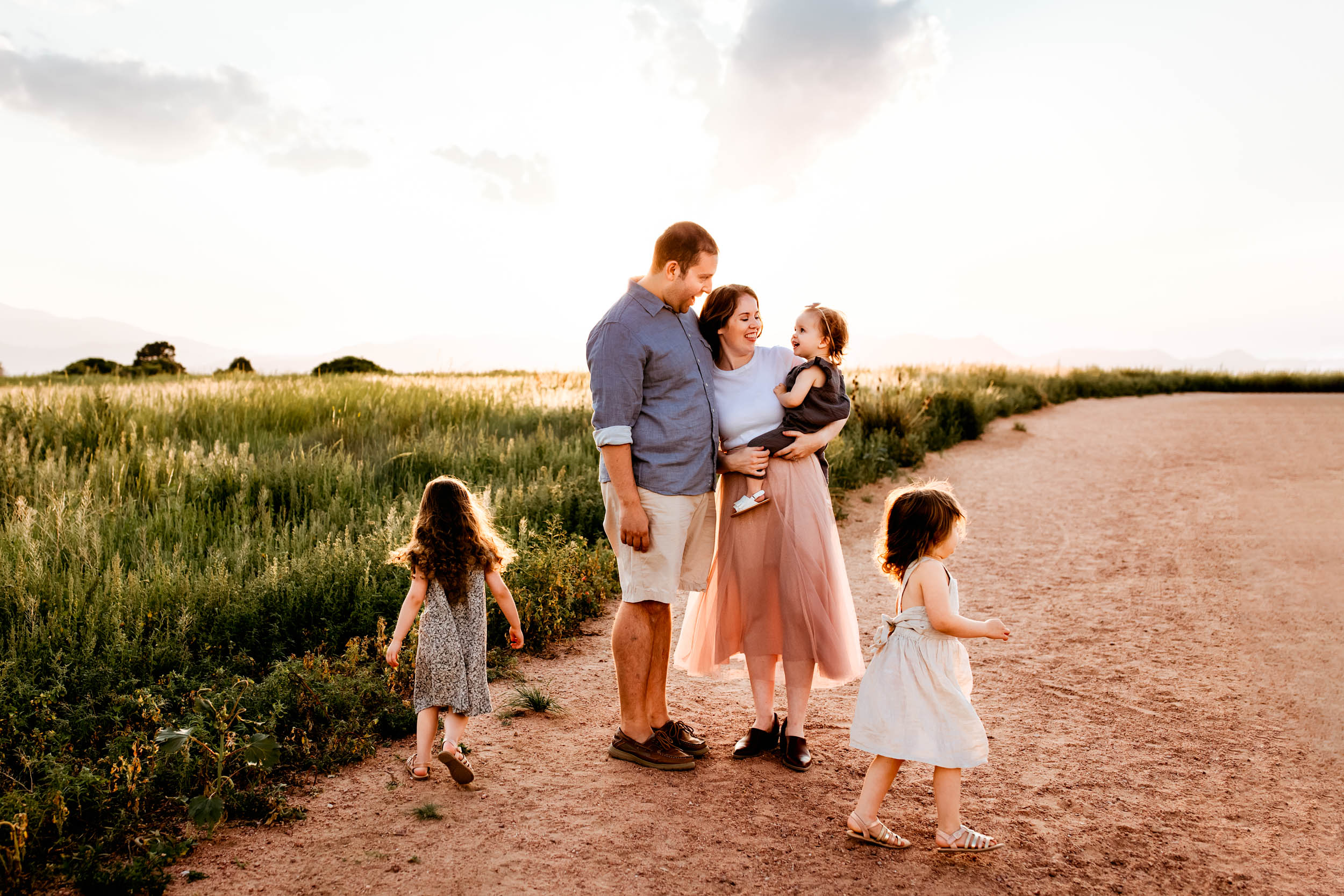 A family of five enjoying a sweet moment at their Colorado Springs Outdoor photography session