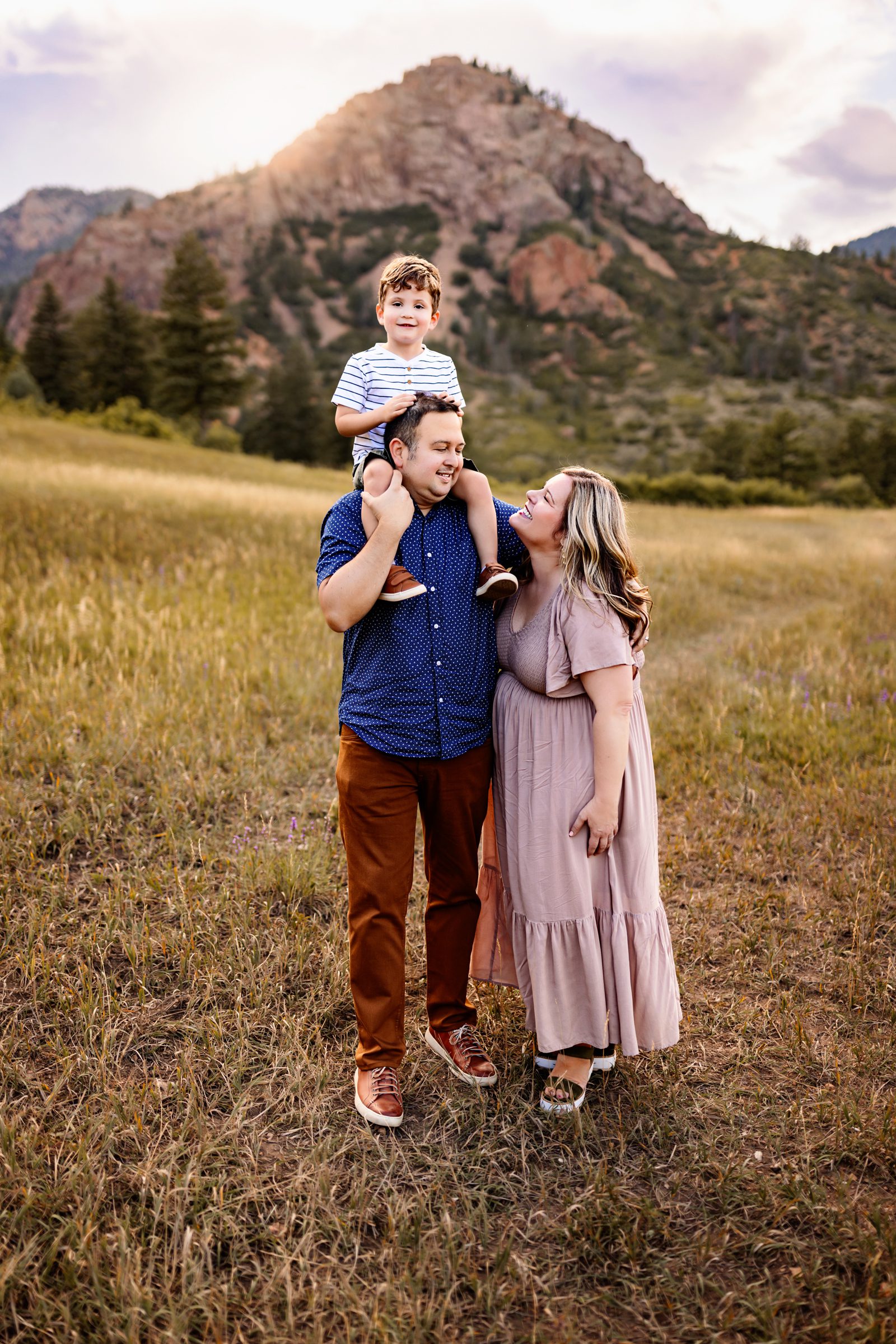Father carrying son on shoulders during Colorado Springs outdoor photography session