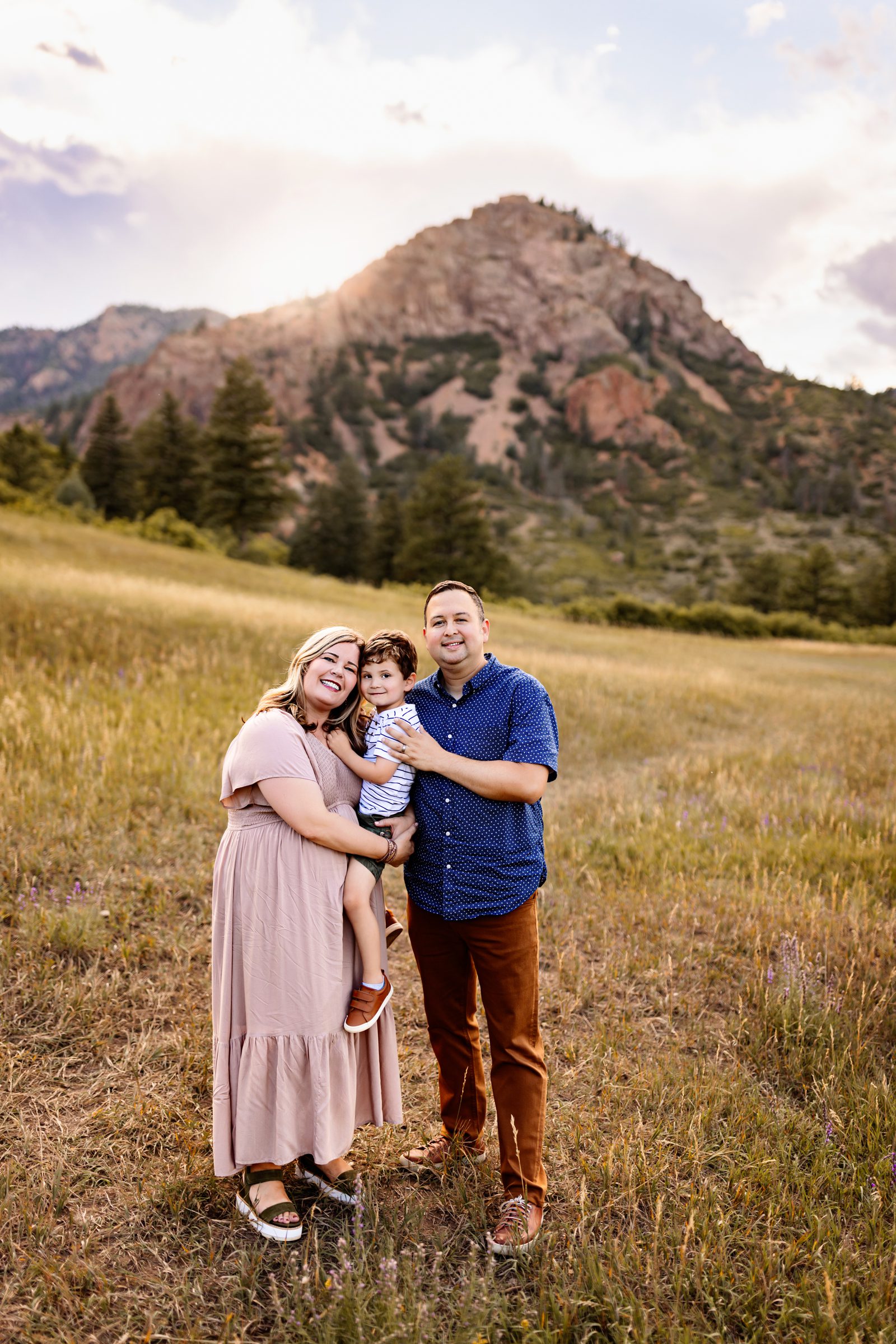 Joyful moment during a Colorado Springs outdoor photography session with warm golden light