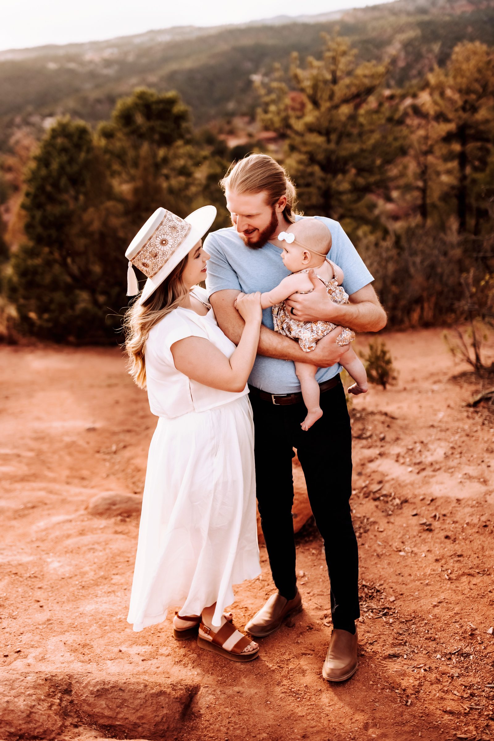 Candid family moment during Spring Photography Sessions in Colorado Springs with warm tones and natural scenery