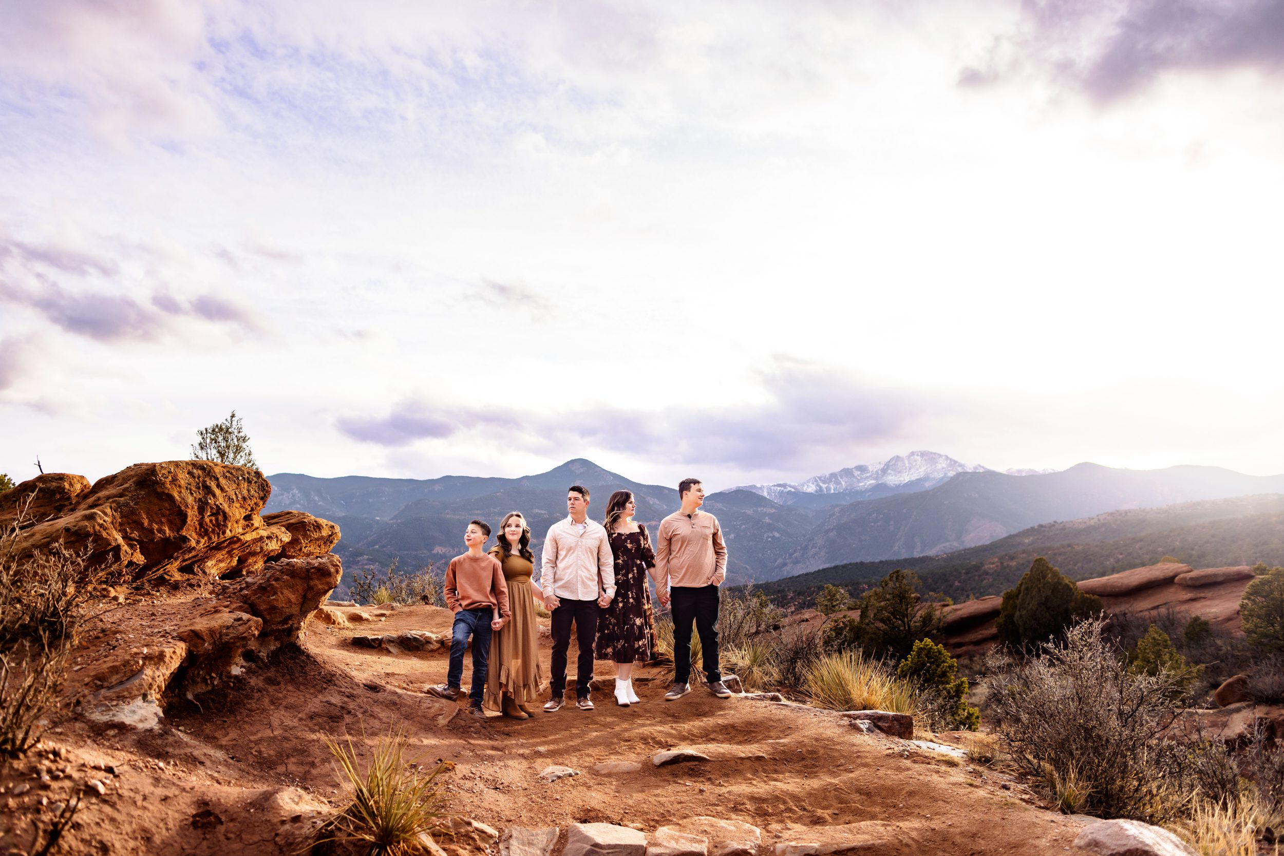 A family of five gazing at the stunning mountain views at Garden of the Gods.