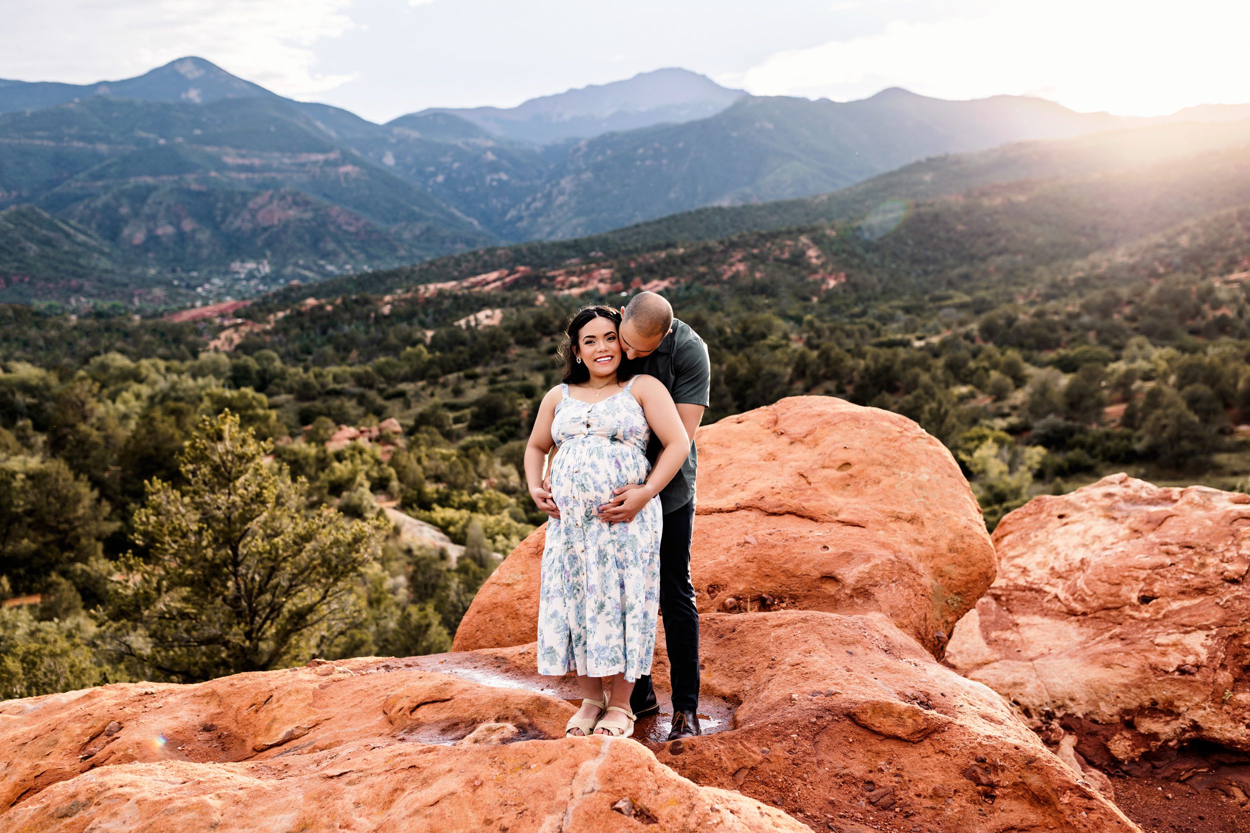 Joyful couple posing together at Garden of the Gods during a Colorado Springs outdoor maternity session