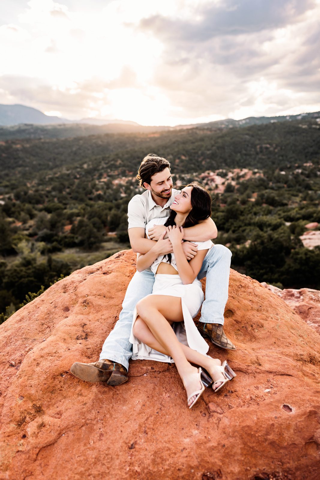 A couple sitting on a rock at Garden of the Gods
