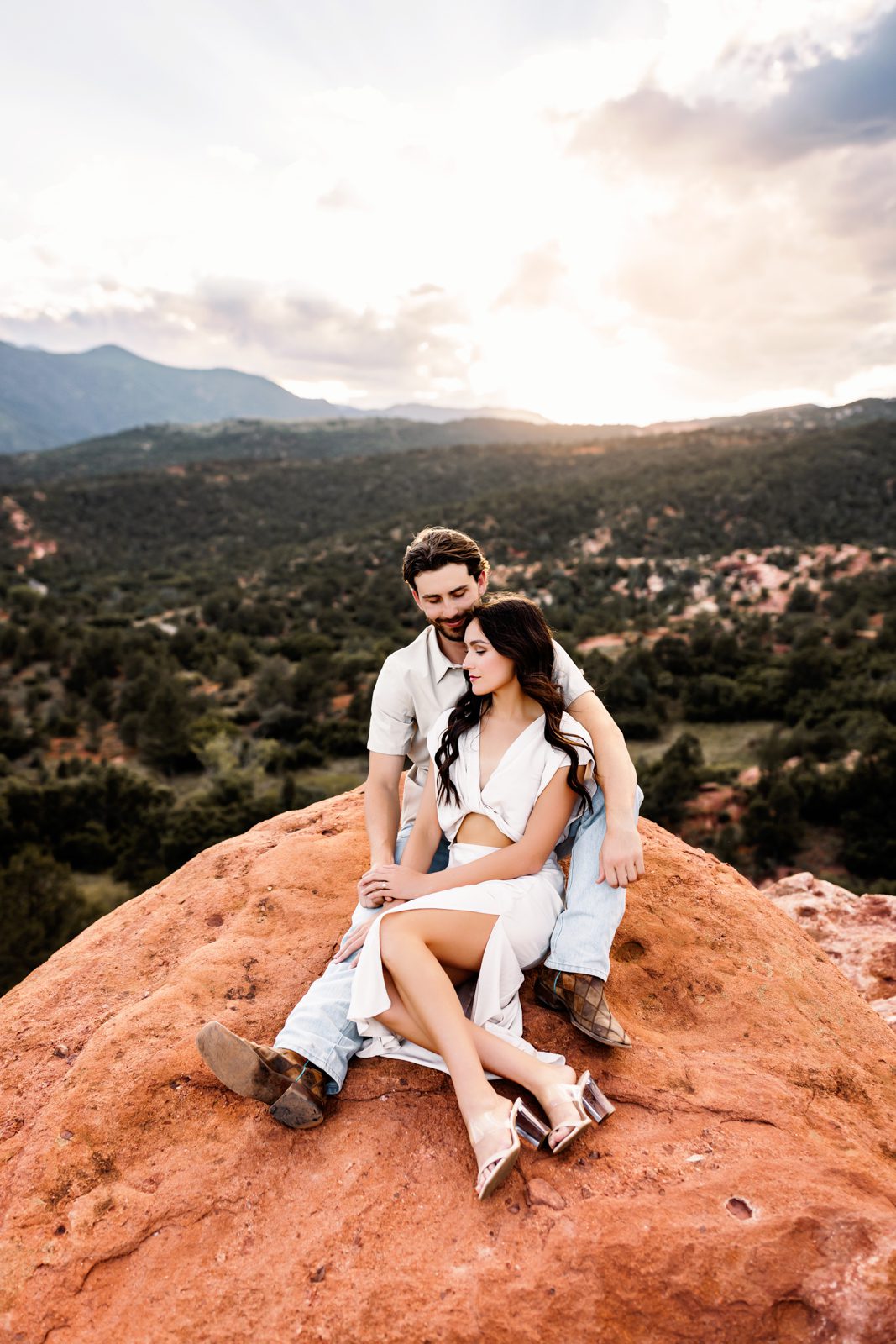 Peaceful, romantic moment captured on the red rocks with a scenic Colorado backdrop.