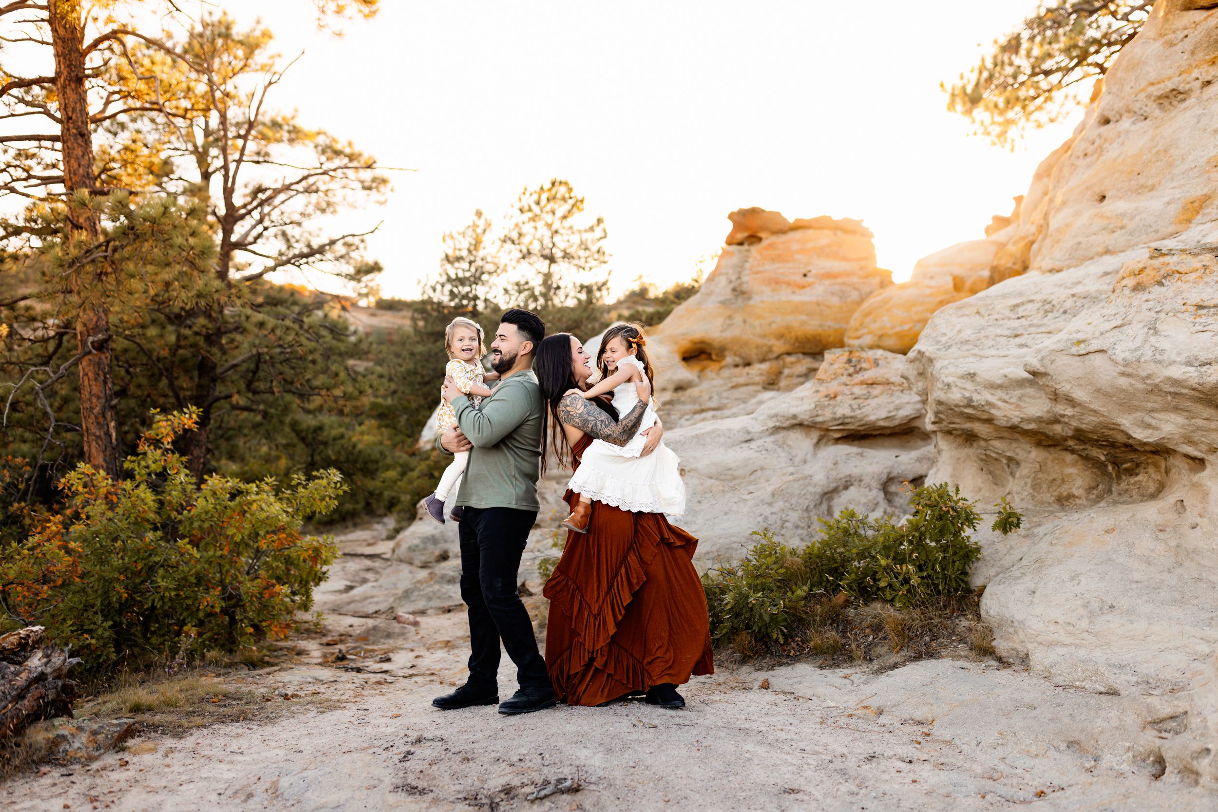 Warm family hugs during a fall foliage photo session in Colorado Springs.