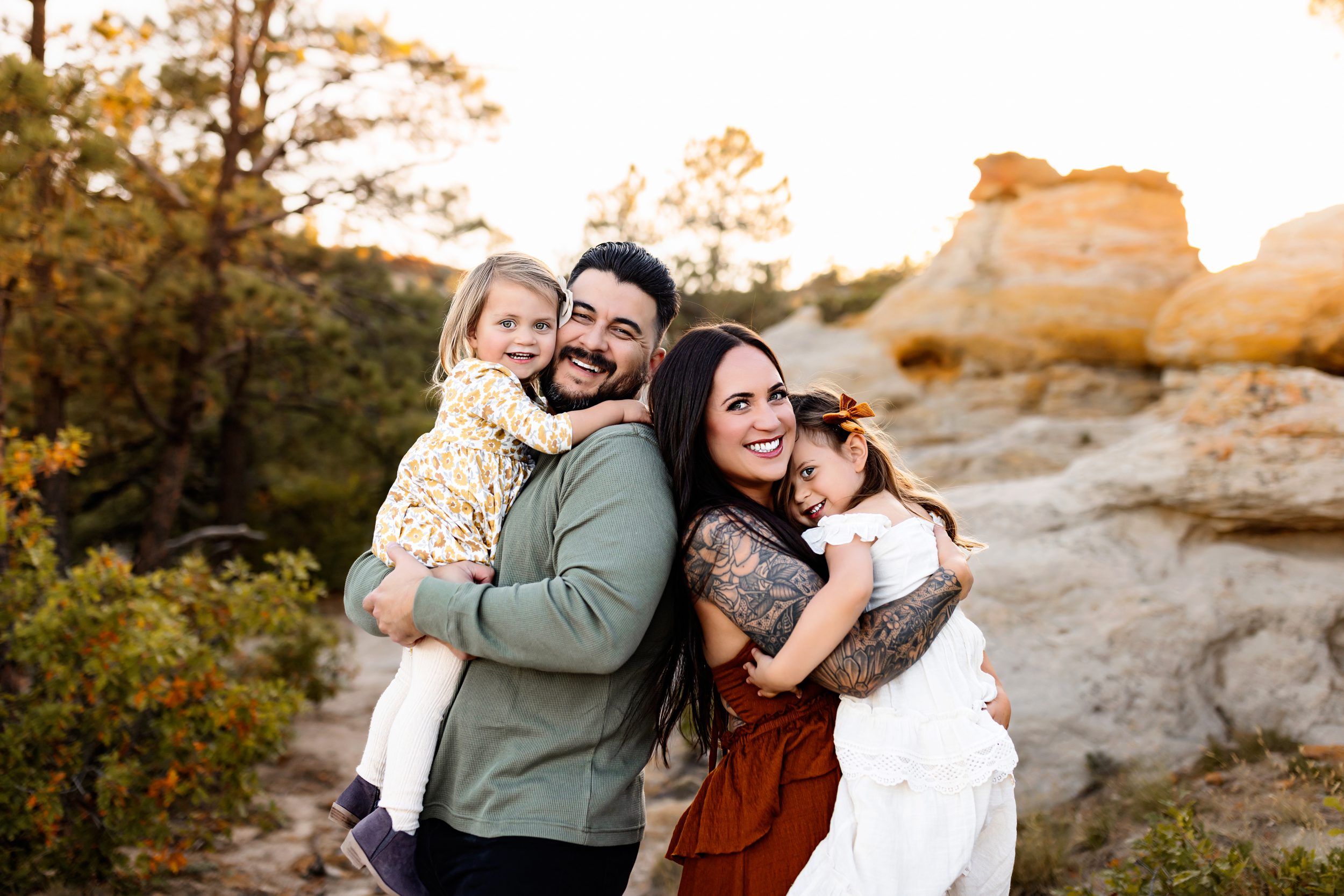 Smiling family enjoying quality time together during their outdoor session.