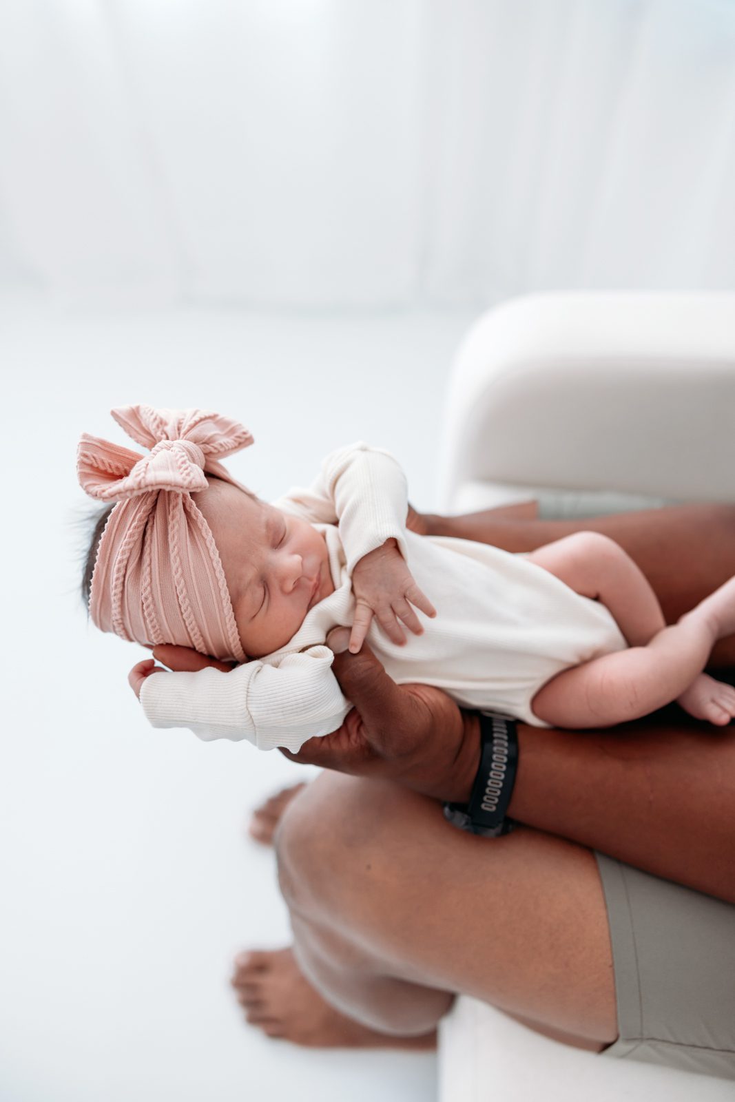 Father holding newborn baby