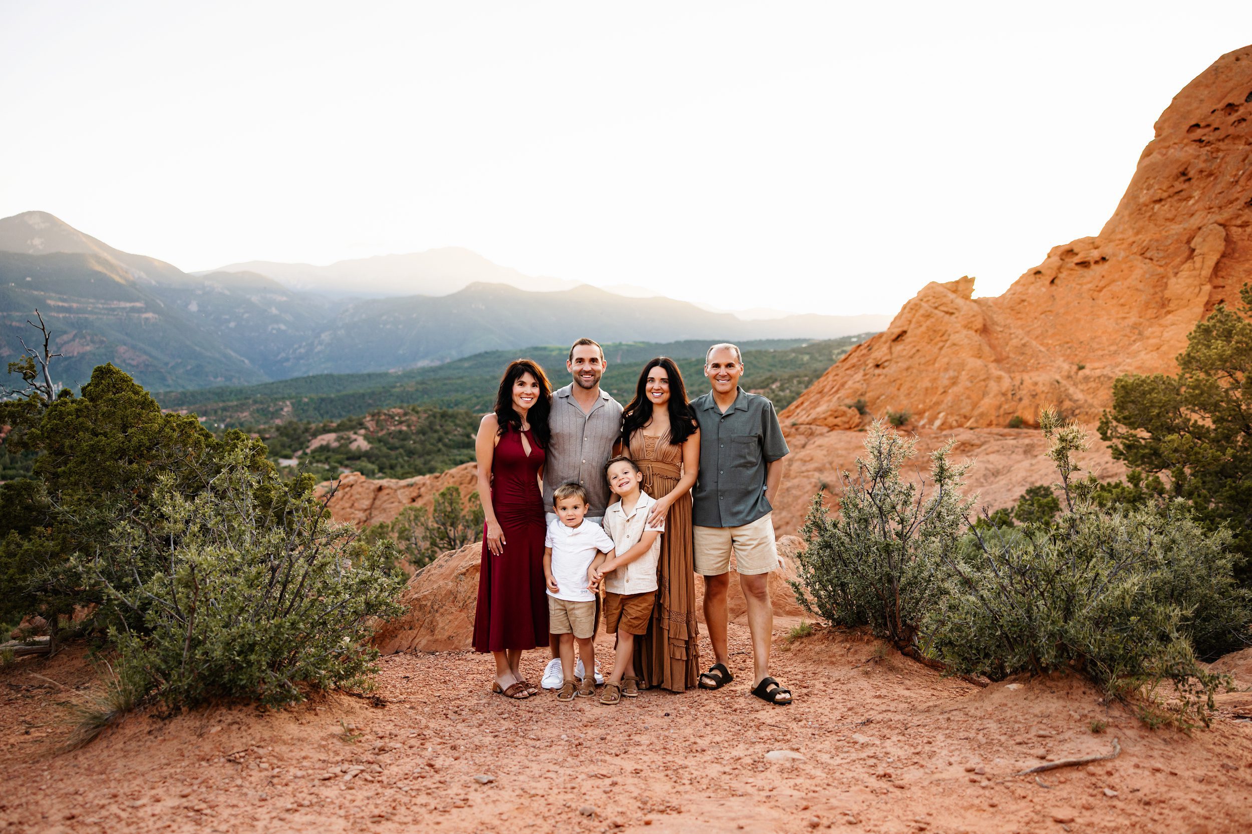 Multi-generational family portrait with grandparents and young children during a sunset session in Colorado Springs