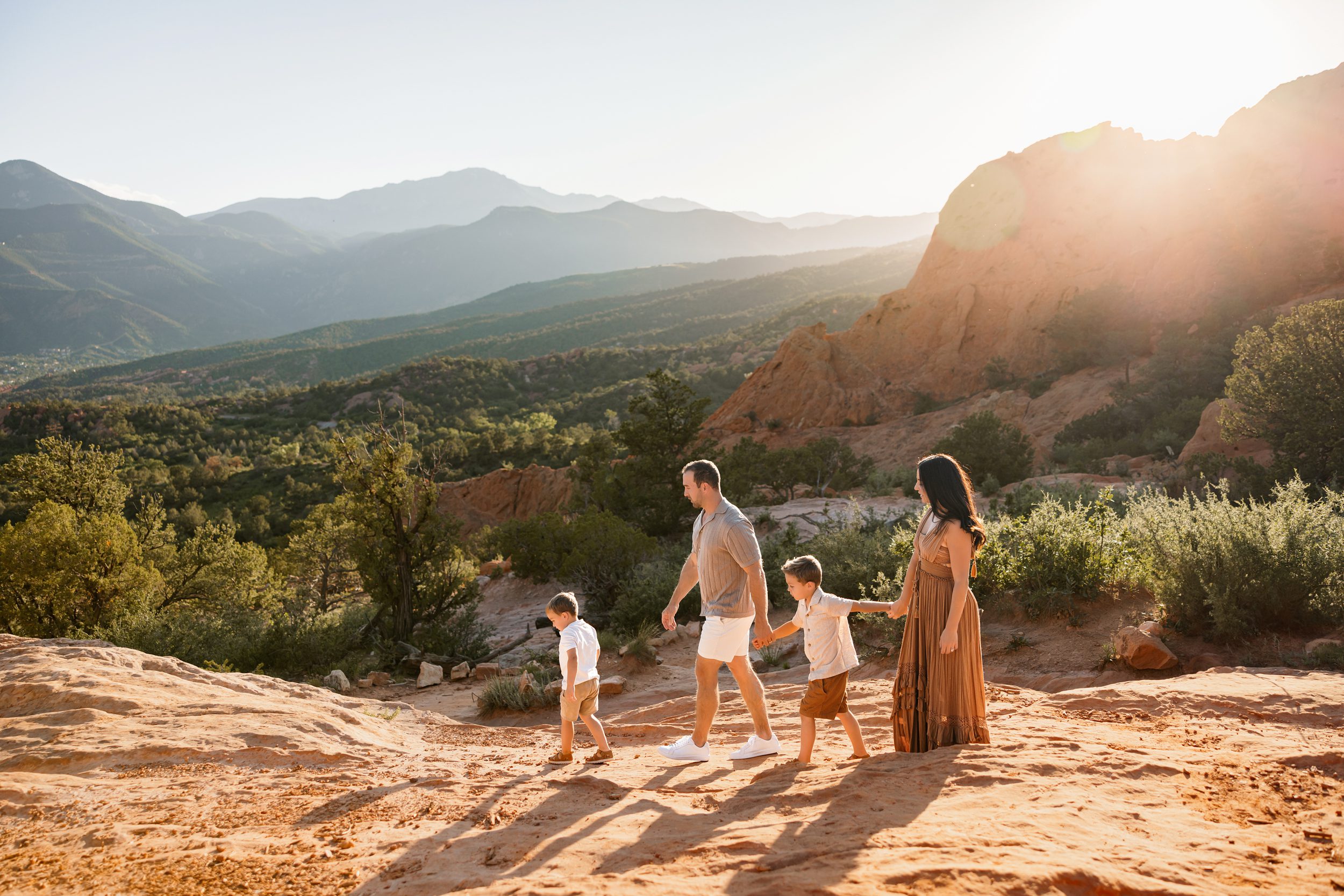 Family walking together at Garden of the Gods at sunset