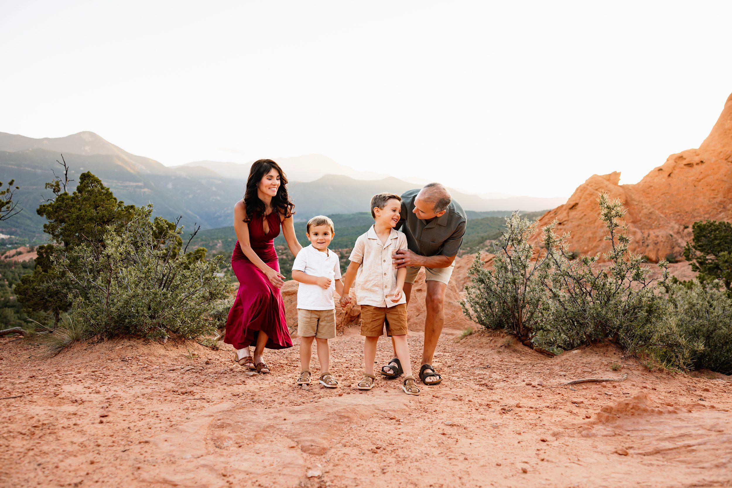 Grandparents playing and walking with young grandchildren during a sunset session in Colorado Springs