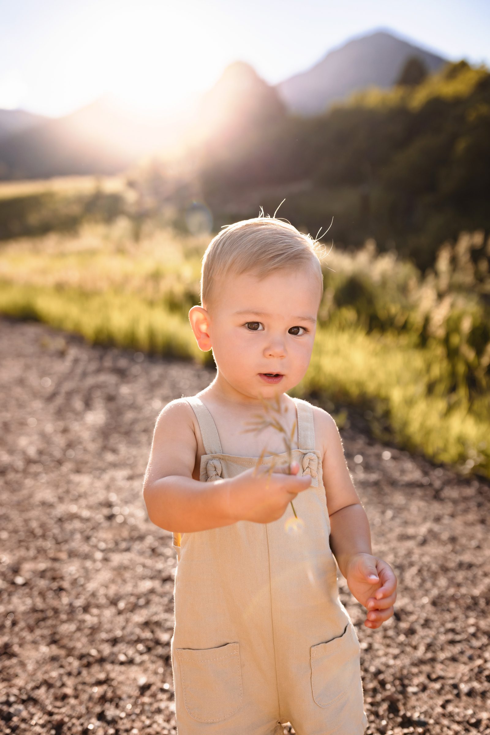 Baby in a simple beige summer outfit perfect for babies and toddlers during outdoor photos