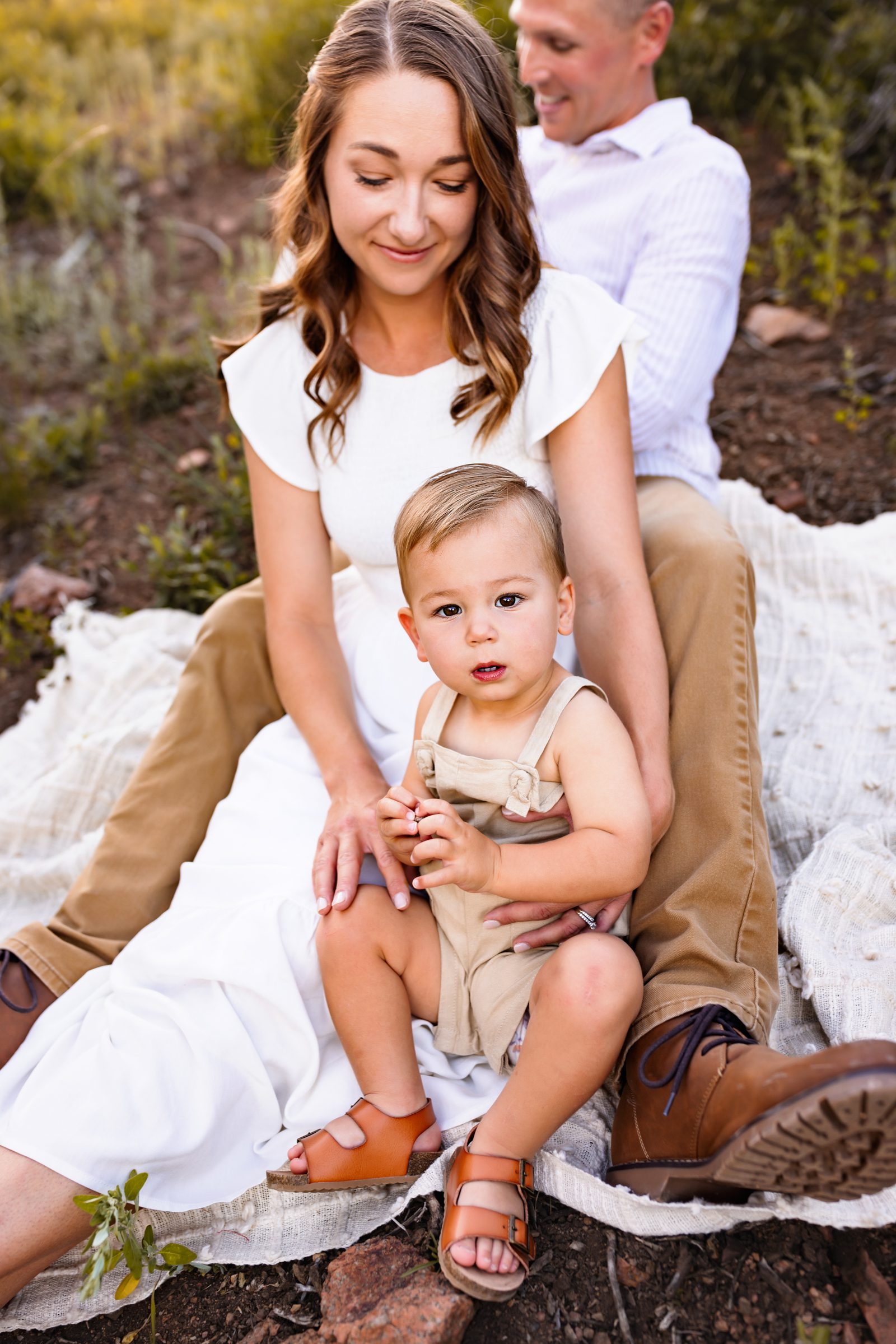 Outdoor family session with a baby in a lightweight neutral summer outfit for toddlers