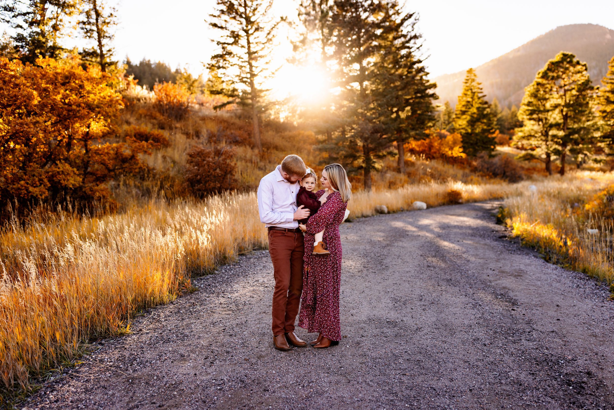 Colorado Springs Fall Mini Sessions 2026 A family standing together on a sunlit path